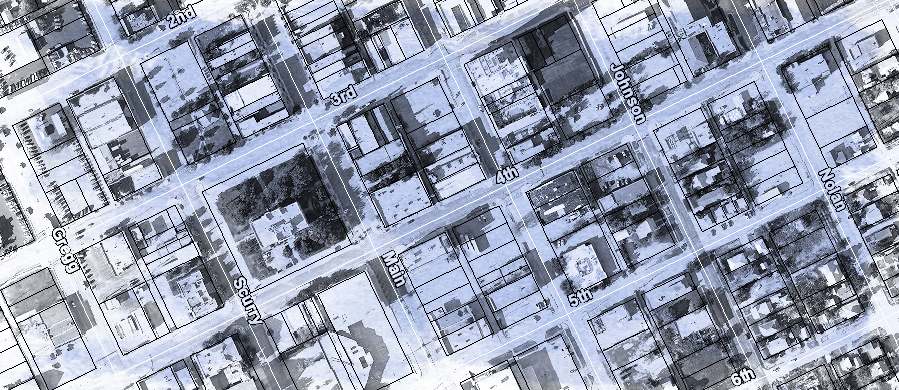 A black and white aerial view image of the downtown area of Big Spring with parcel lines